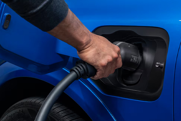 Close up of a Chevy EV plugged in charging