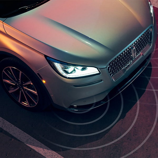 The front of a Lincoln vehicle is shown here using Blind Spot Information System to identity nearby vehicles
