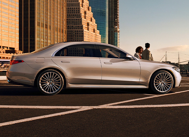 Side profile view of a Mercedes Benz at sunset